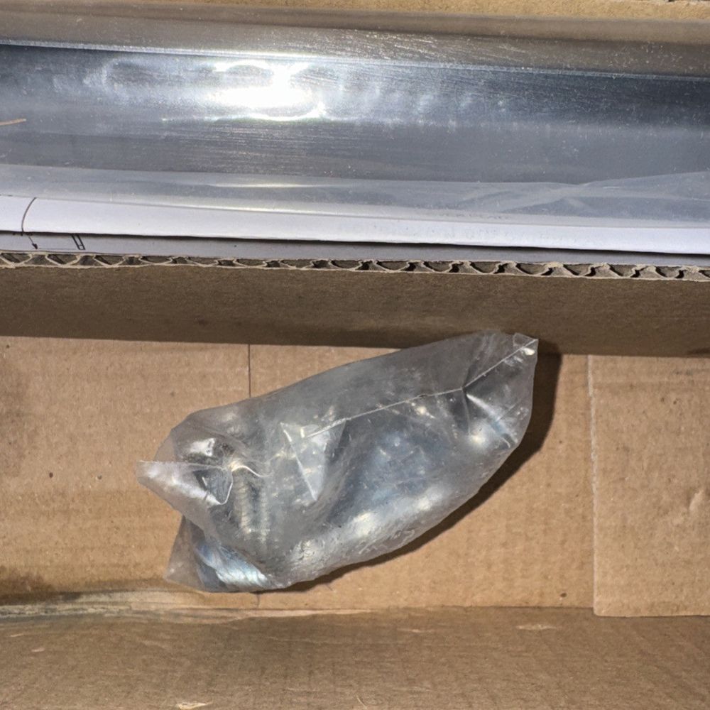 Deltana DASH95U26D Solid Brass Double Action Spring Hinge with Solid Brass Cover – a plastic bottle is sitting in a cardboard box