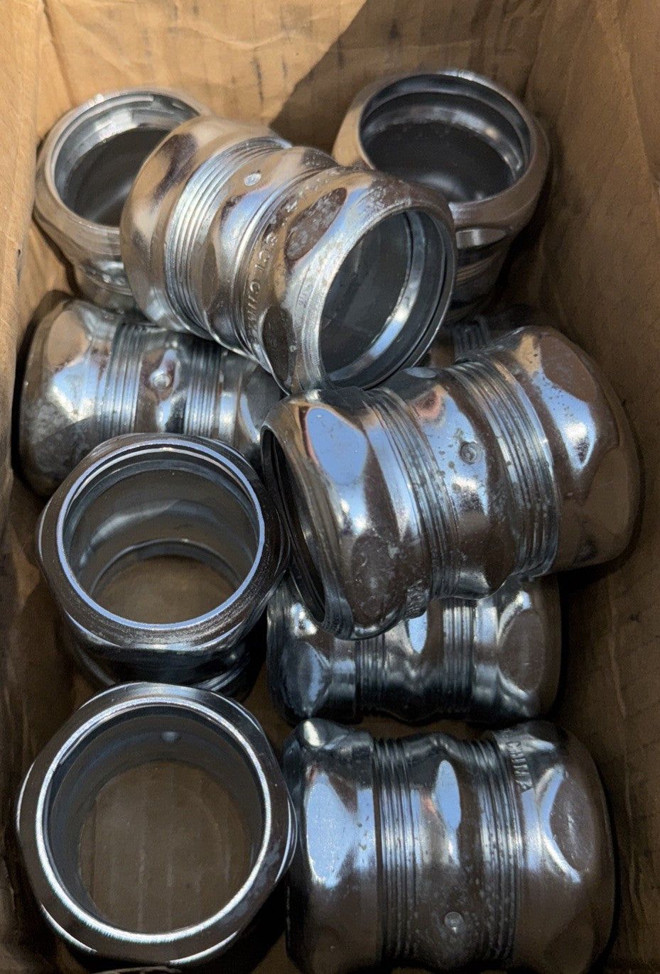 ATKORE CK125RKON 1-1/4" Compression Coupling 10 Pack – a box full of aluminum cans