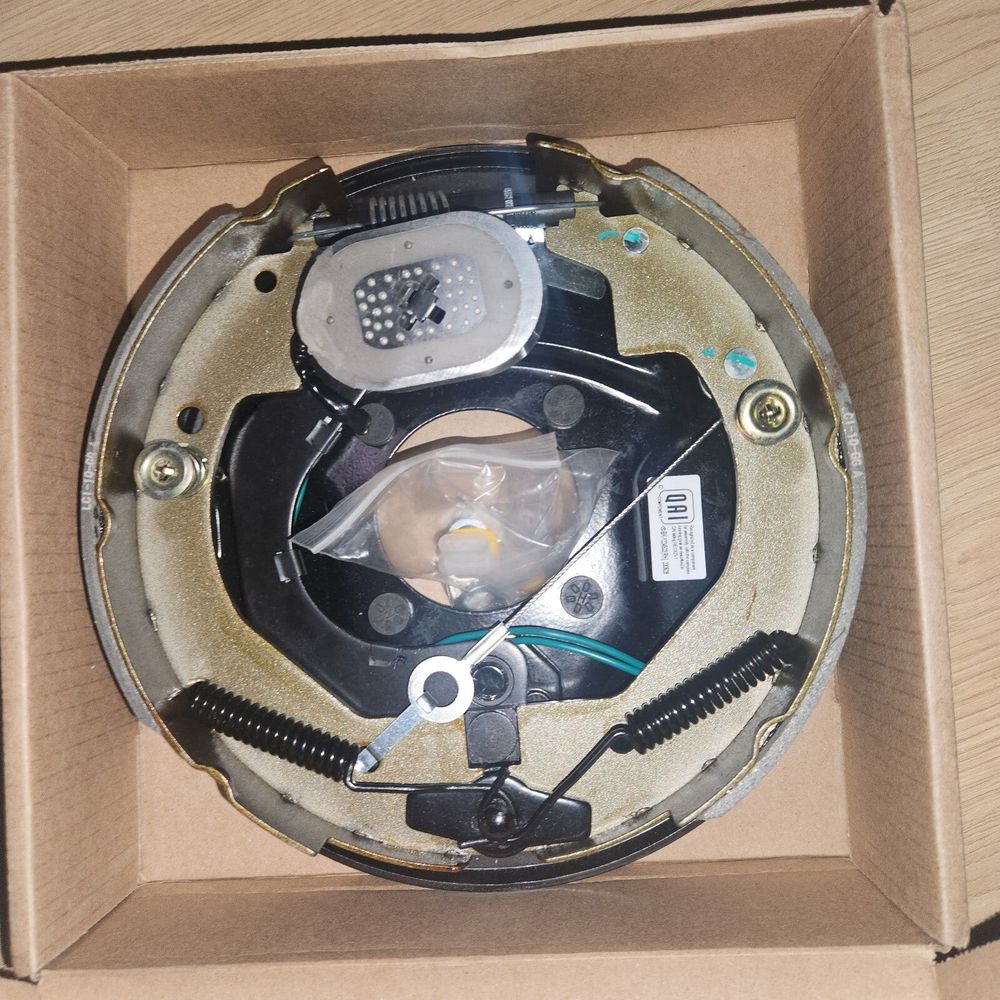 Lippert Forward Self-Adjusting Replacement Brake Assembly for RVs, Right Side, – a box with a clock inside of it