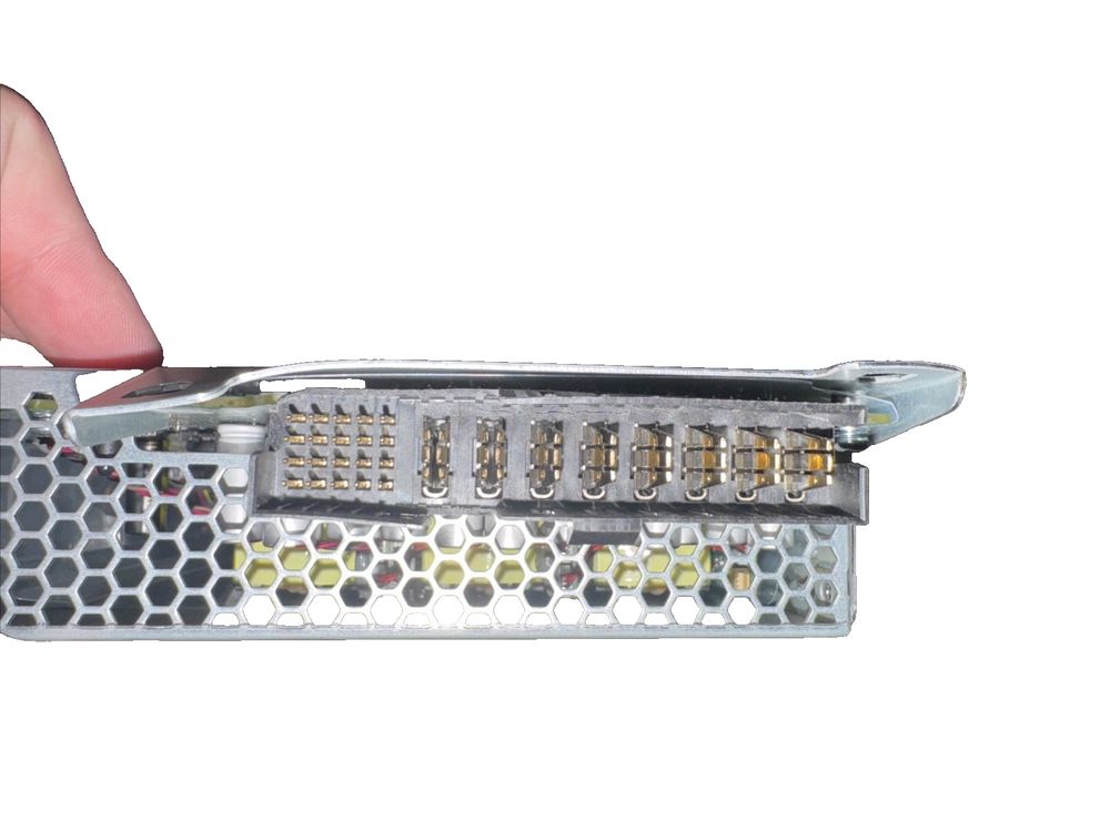 Flextronics 12.25V Switching Power Supply - 81.5A MIS-S-2100ADE00 – a hand holding a metal device with a metal cover
