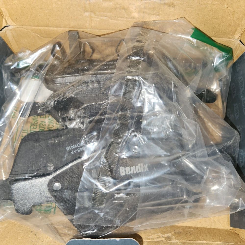 Front Ceramic Disc Brake Pads CMX-D1796 Replacement For Mercedes-Benz C300 GLC3 – a box of shoes and a pair of shoes