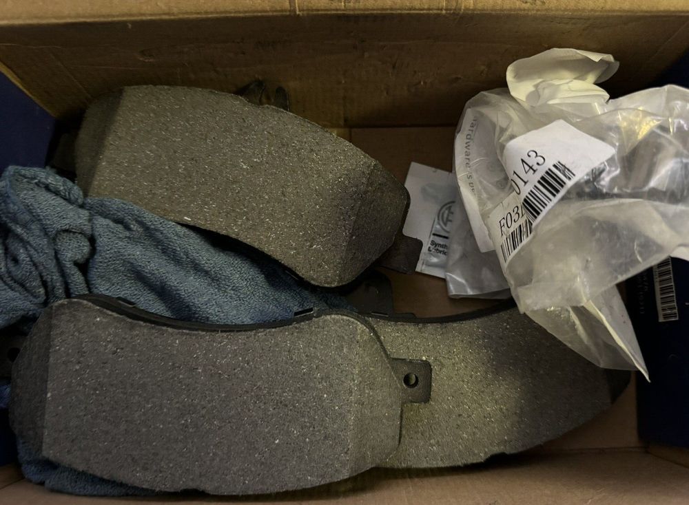 BOSCH BE1406H Blue Ceramic Disc Brake Pad Set With Hardware - Compatible With Se – a box of shoes and a pair of socks