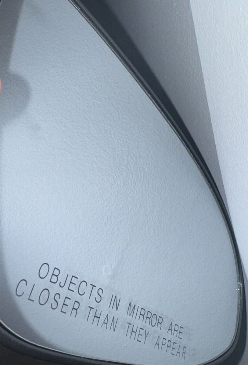 Fit System Passenger Side Non-heated Mirror Glass w-backing plate, Toyota Camry – a mirror with a reflection of a person in it