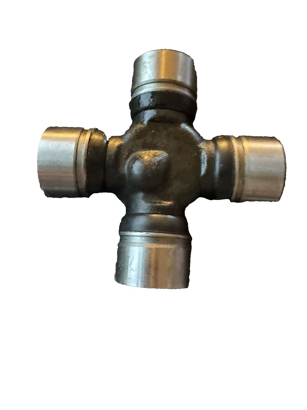 MOOG 489 Non-Greaseable Super Strength Universal Joint for Jeep Wrangler – a brass cross with a white background