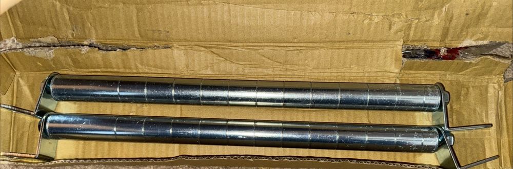 Tarrison - 14" Post Wall Mount with PolySeal Clear Epoxy Finish - PK14Z – two cylinders in a cardboard box