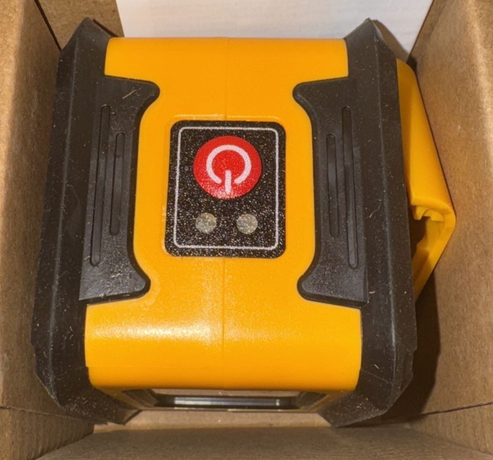 Mcro XRX010-L Self Leveling laser – a yellow and black object in a cardboard box