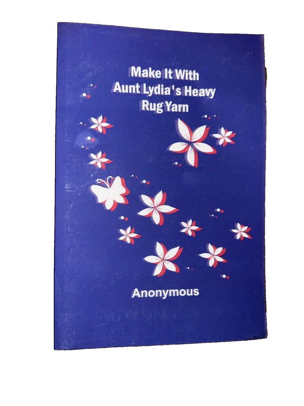 Make It With Aunt Lydia's Heavy Rug Yarn, DaveyDooDeals – an old book with a blue cover and red and white butterflies