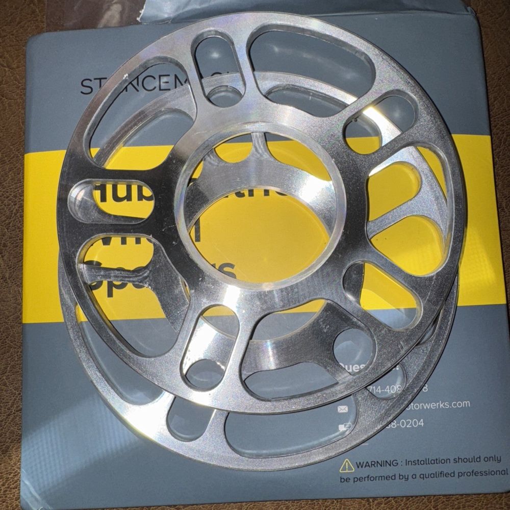 2PCS 5MM HubCentric 5X100 And 5x112 Wheel Spacers – a reel on a box with a yellow label
