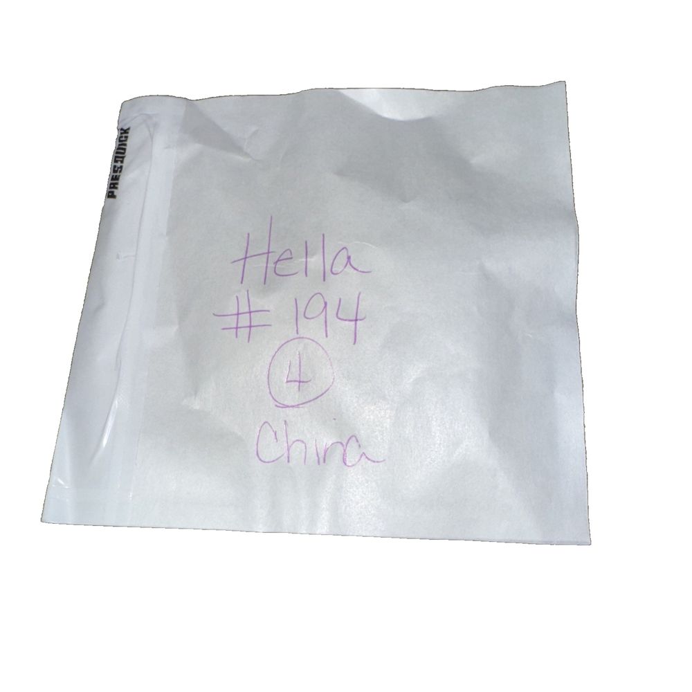 HELLA (194) 12V Bulb 4 Pack, Pres-Quick – a white bag with purple writing on it