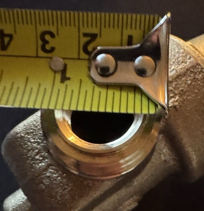 Watts LF N55B M1 1/2 Water Pressure Reducing Valve – a brass pipe with a measuring tape on it