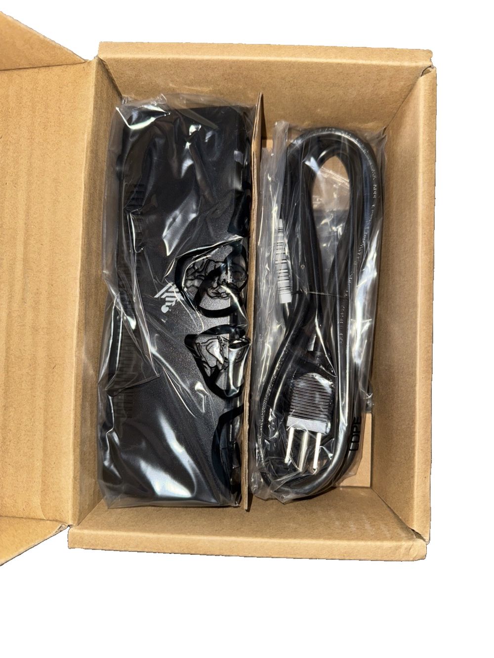Zebra 3-Slot Battery Charger - battery charger – a box of black shoes with a pair of shoes inside