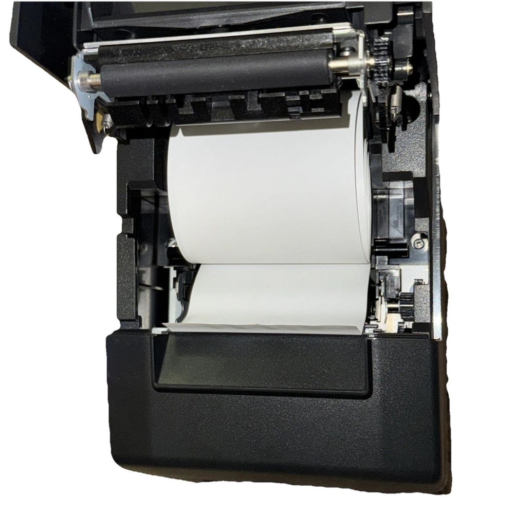 Star Micronics TSP650 Series Thermal Printer No Cables/Extras – a printer with a roll of paper on it
