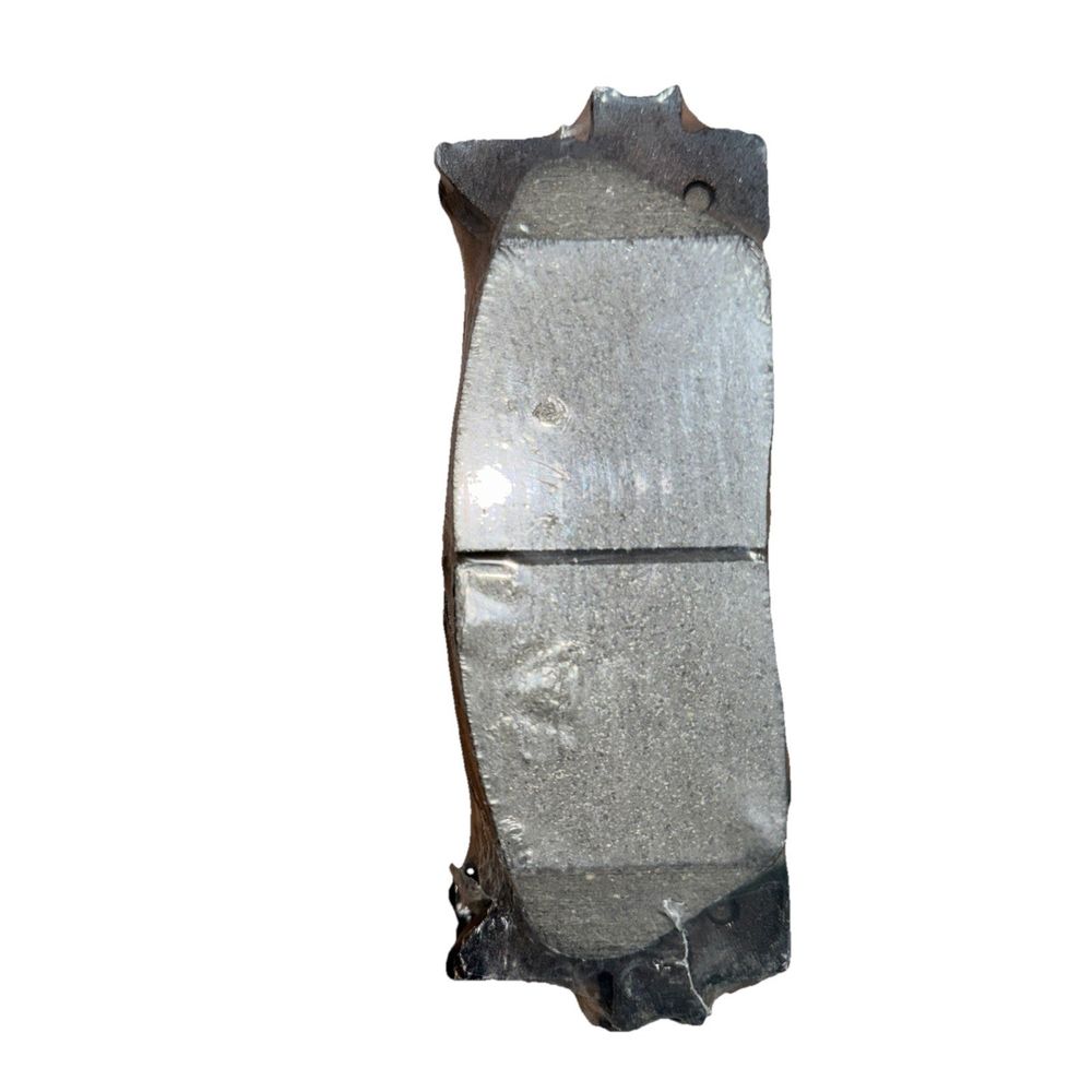 Dynamic Friction 4000-1293-00 - 4000 HybriDynamic Brake Pads – a piece of metal with a white background