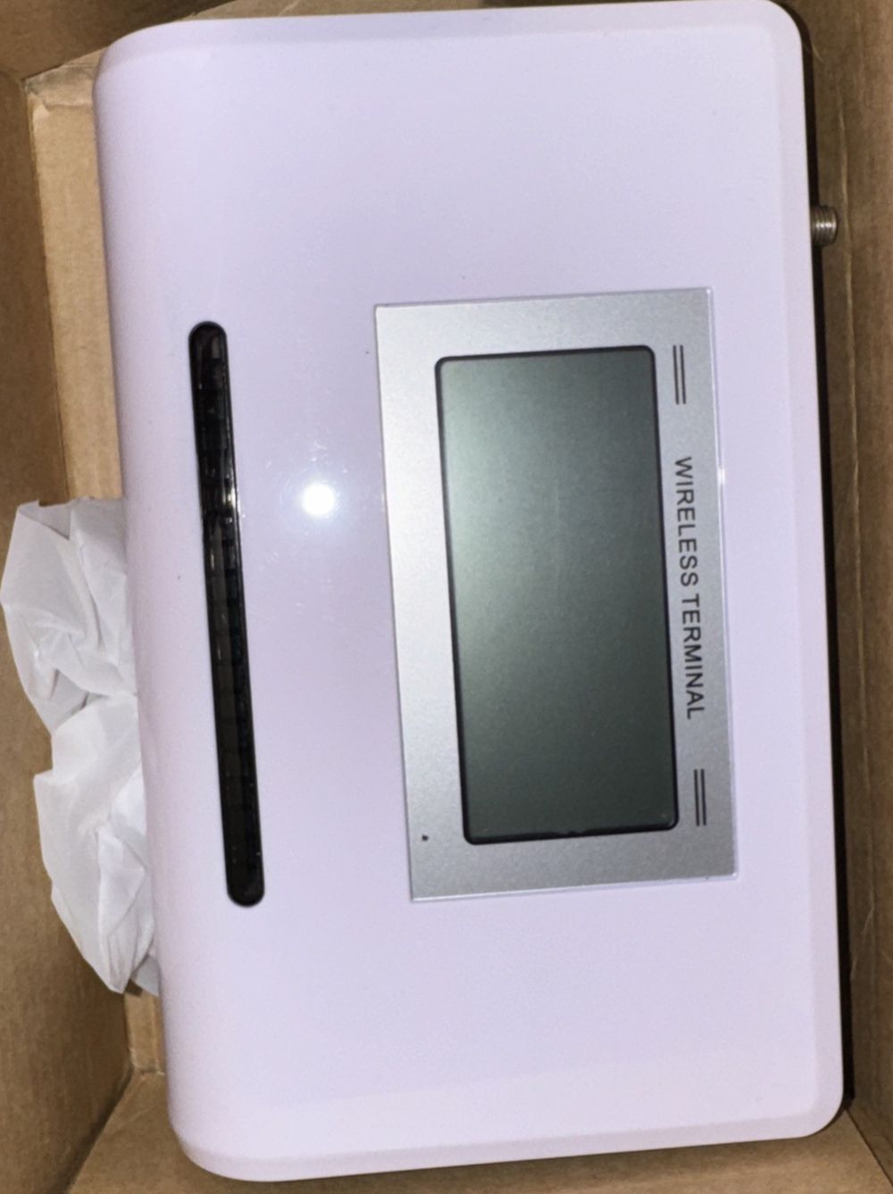 Fixed Wireless Terminal, Unbranded – a white box with a white and black electronic device