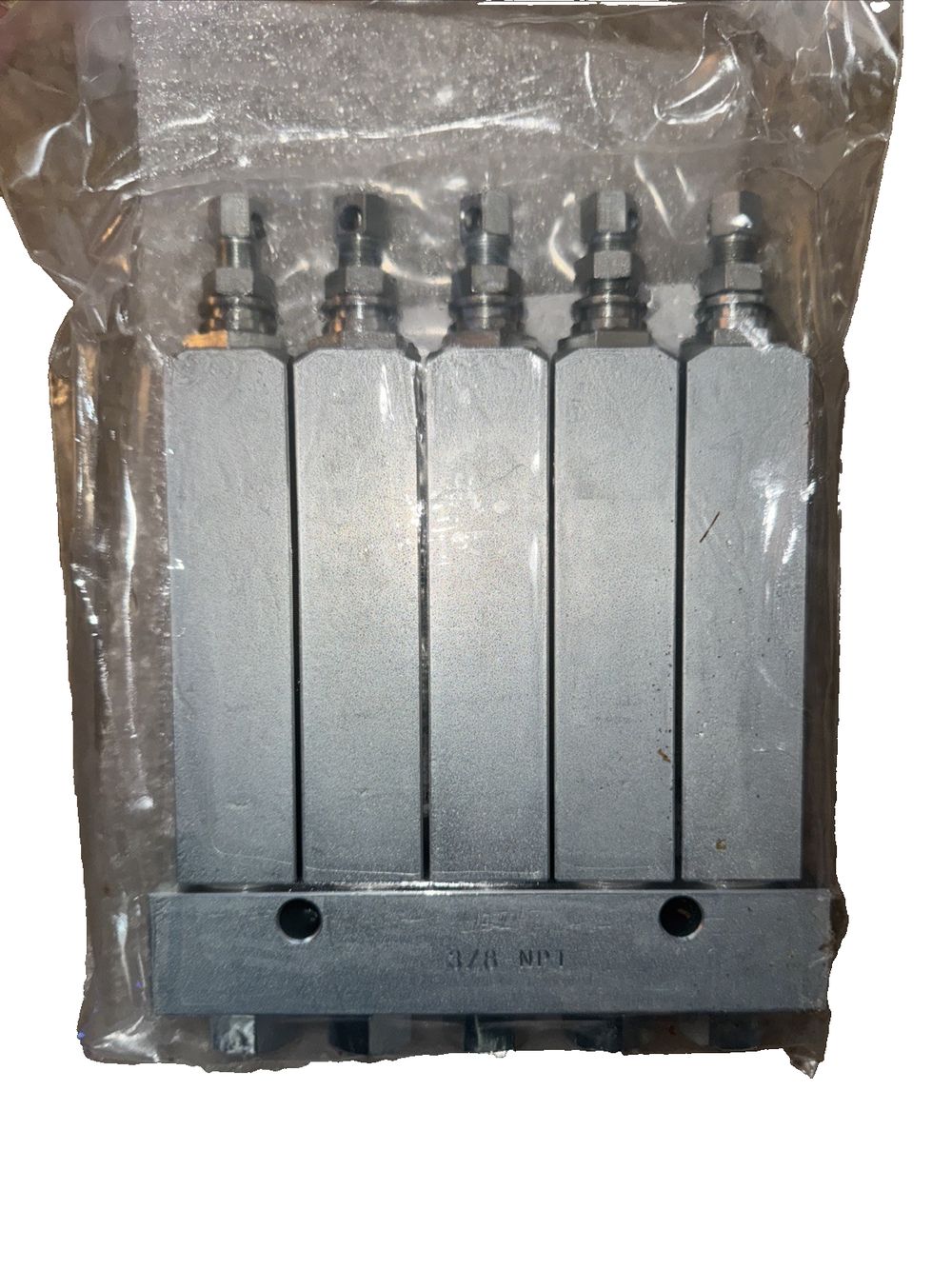 Graco 24X805 GL-1 X Injector, 5 Point - High-Performance Fluid Delivery Solution – a plastic bag with three metal cylinders