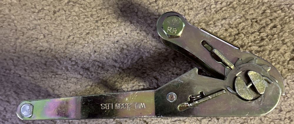 3,335 LBS Heavy Duty Ratchet - Premium Strength & Durability for Tough Jobs, Unbranded – a pair of metal latches on a carpet