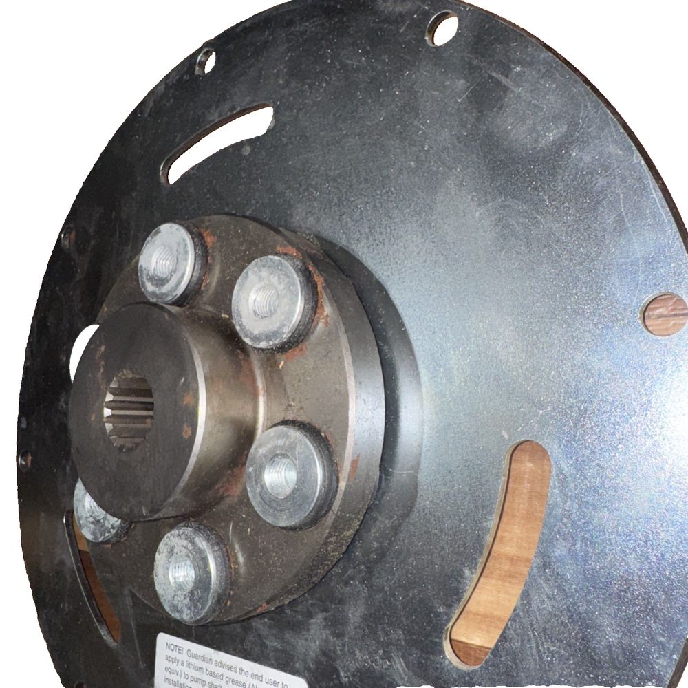 Genie Lift Part #128022GT - Guardian Couplings – a close up of a metal disc with a white background