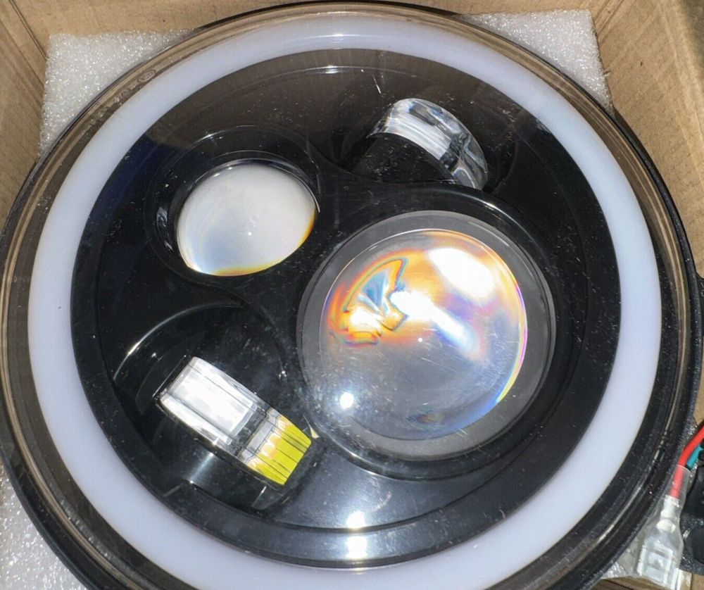 MGLLIGHT 7 Inch LED Headlights with Blue Halo Amber Turn Signal Lights H6024 LED – a box with a light inside of it