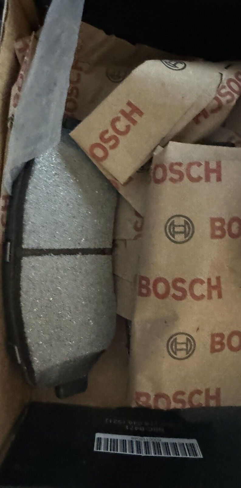 Bosch BC1623 QuietCast Premium Ceramic Disc Brake Pad Set Missing Hardware – a box of pizza with a knife and a box of pizza