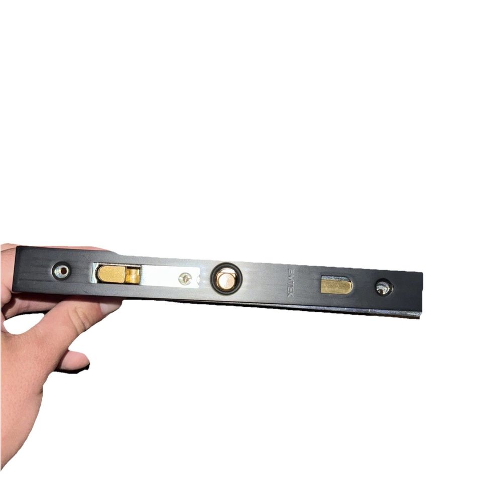 Emtek 2185 Square Privacy Pocket Door Mortise Lock, Emtec – a hand holding a metal ruler