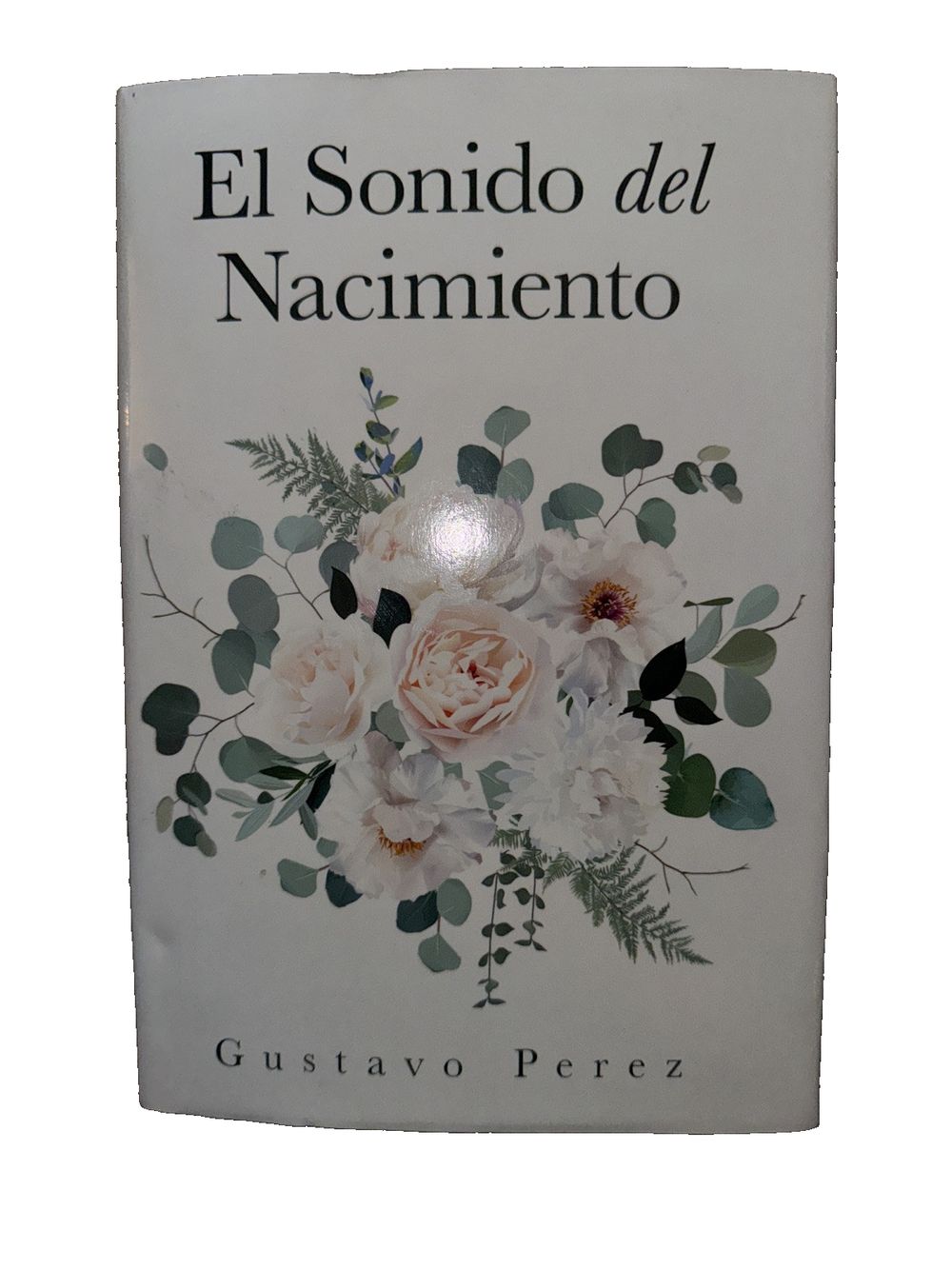 El Sonido Del Nacimiento, DaveyDooDeals – a book with flowers and leaves on it