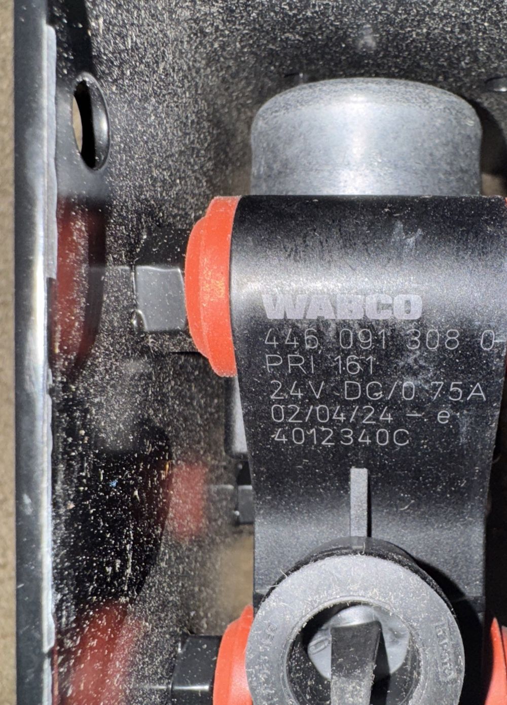 Climate Control - Water Control Valve, WABCO – a close up of a skate board with a black and red handle