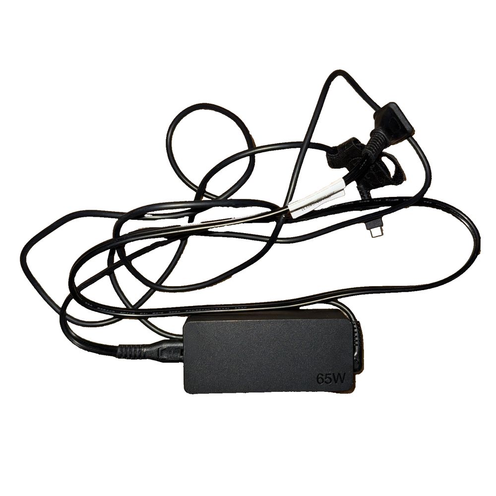 Lenovo 65W AC Adapter – a black cable connected to a white wall
