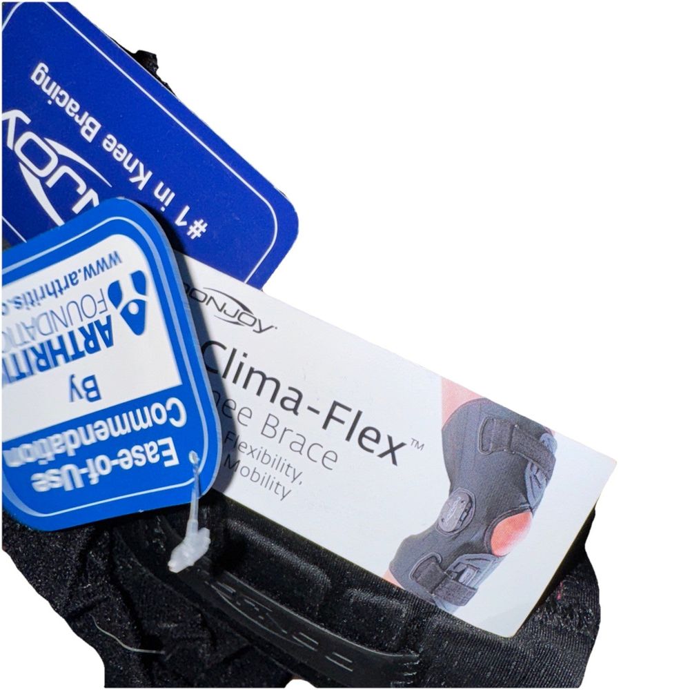 Donjoy Clima-Flex Knee Brace – a pair of black shoes with a blue tag