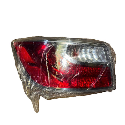 TYC 11-6422-00 Mazda CX-9 Replacement Tail Lamp – a red headlight with a plastic covering