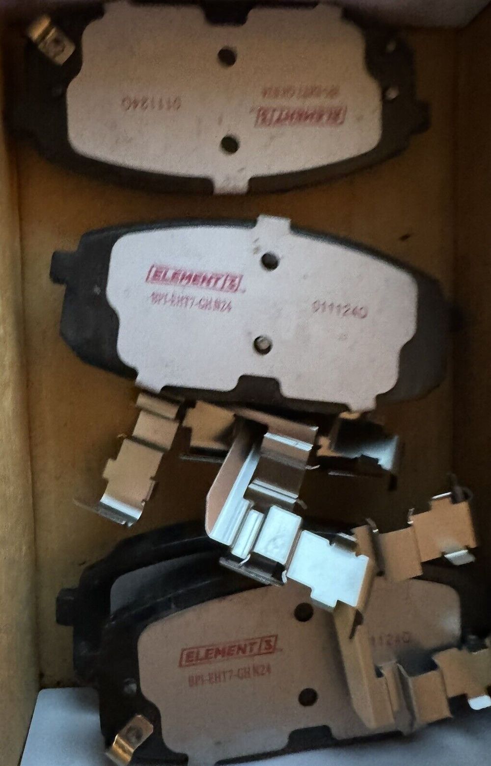 Raybestos Premium Raybestos Element3 EHT Replacement Front Brake Pad Set for 18 – a box of brake pads and a pair of brake pads