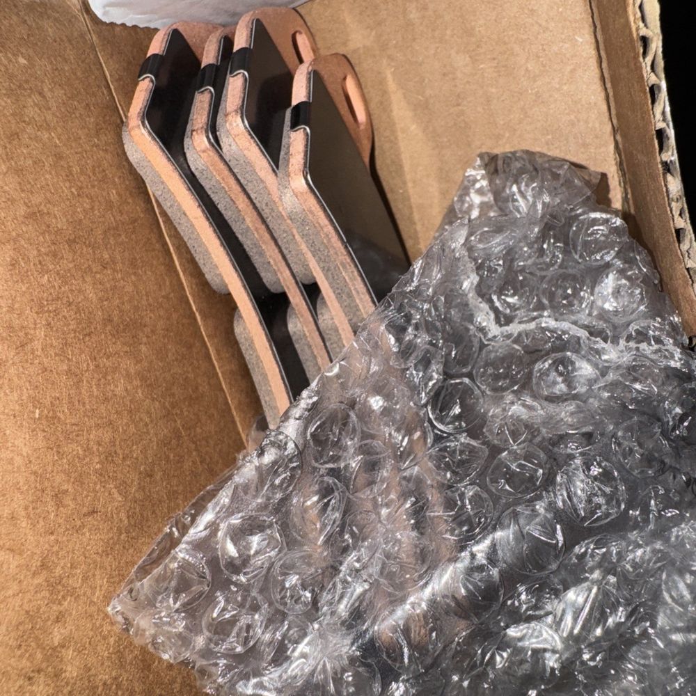 Brake Pads Kit Assembly, Part 2206231, Set of Two Brake Pads, Polaris – a pair of shoes is sitting in a box