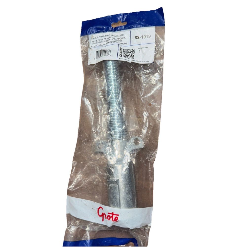 Trailer Plug, 7 Pole, W/Guard, Die Cast #GRO82-1019, Grote – a large metal bolt in a plastic bag