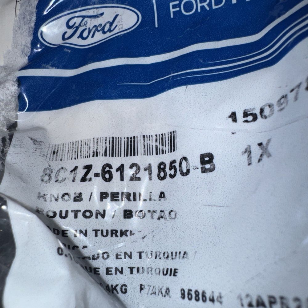 2010-2013 Ford Transit Connect - Lock Knob - Ford (8C1Z-6121850-B) – a bag of food that is sitting on a table