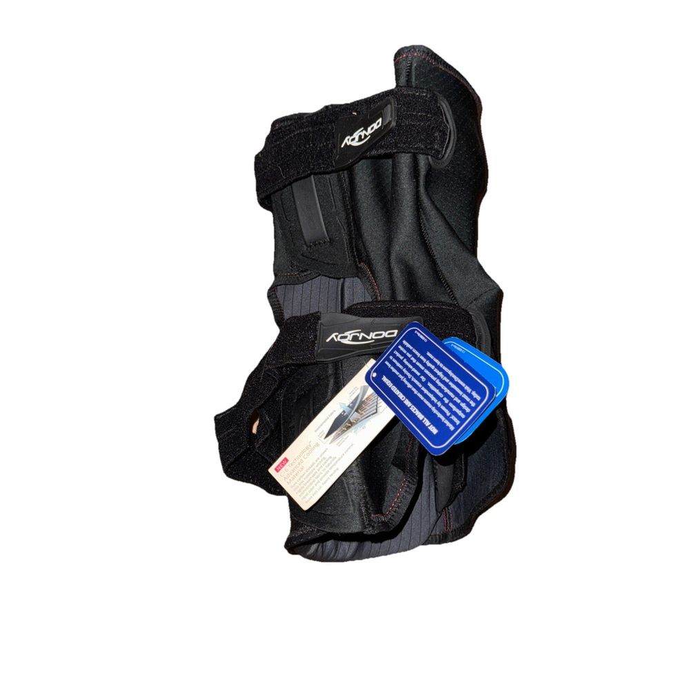Donjoy Clima-Flex Knee Brace – a black bag with a blue tag on it