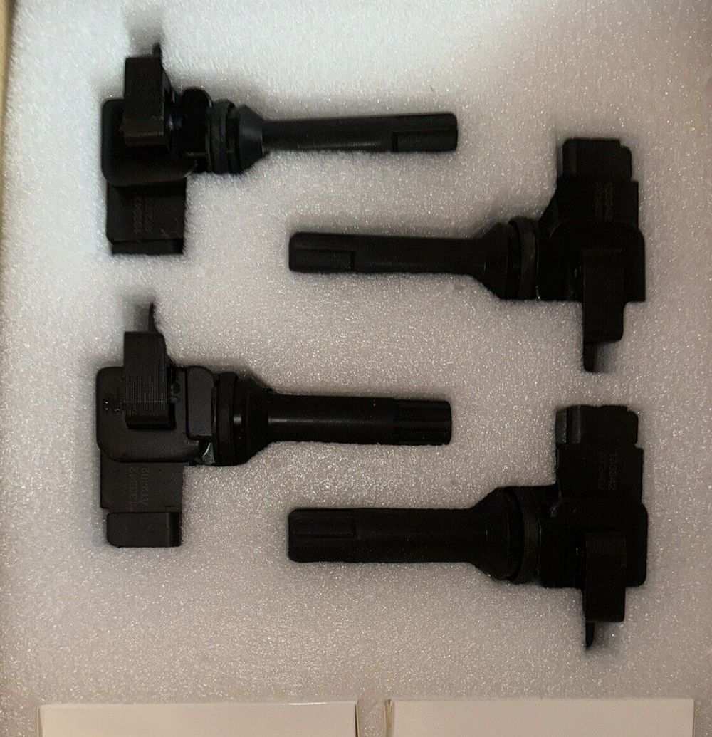 SCITOO 4 ignition coils with 4 iridium Spark Plugs for Subaru Forester 2.5L H4 – a box of black plastic parts