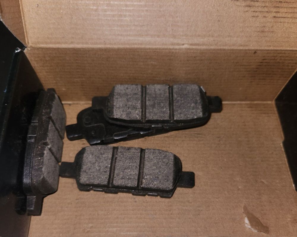 Bendix Premium Rear Brake Pads Compatible With Select Infiniti-Nissan 350Z, 370Z – a box with two brake pads and a pair of brake pads