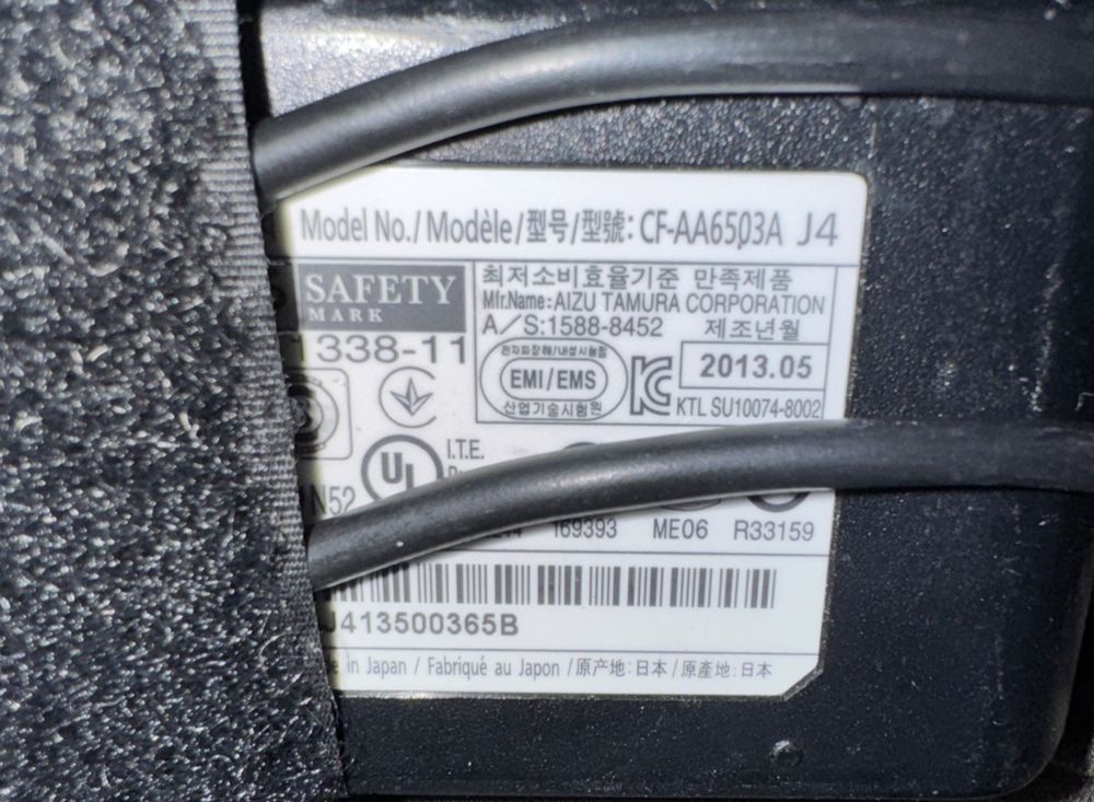 Panasonic CF-AA6503A M4 Power Adapter (NO Wall Input Cord) – a close up of a black and white label on a black and white label