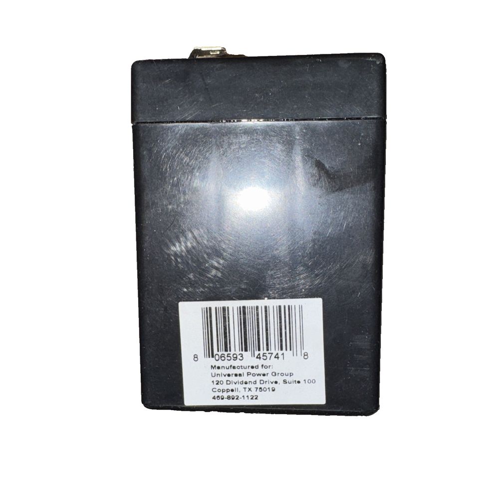 UPG UB1250 Sealed Lead Acid Battery – a black plastic box with a barcode on it