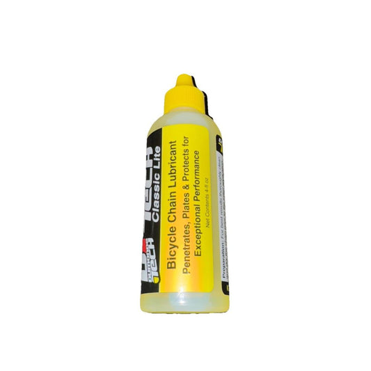 Lube Dumonde Tech Classic LiteChain Lube 4 oz – a yellow bottle of glue glue