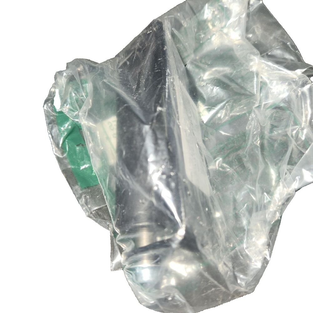 Lippert J-33 Roller (1.55" H x 4" W x 3.63") - Compatible with Lippert Slide-Out – a piece of glass with a green substance