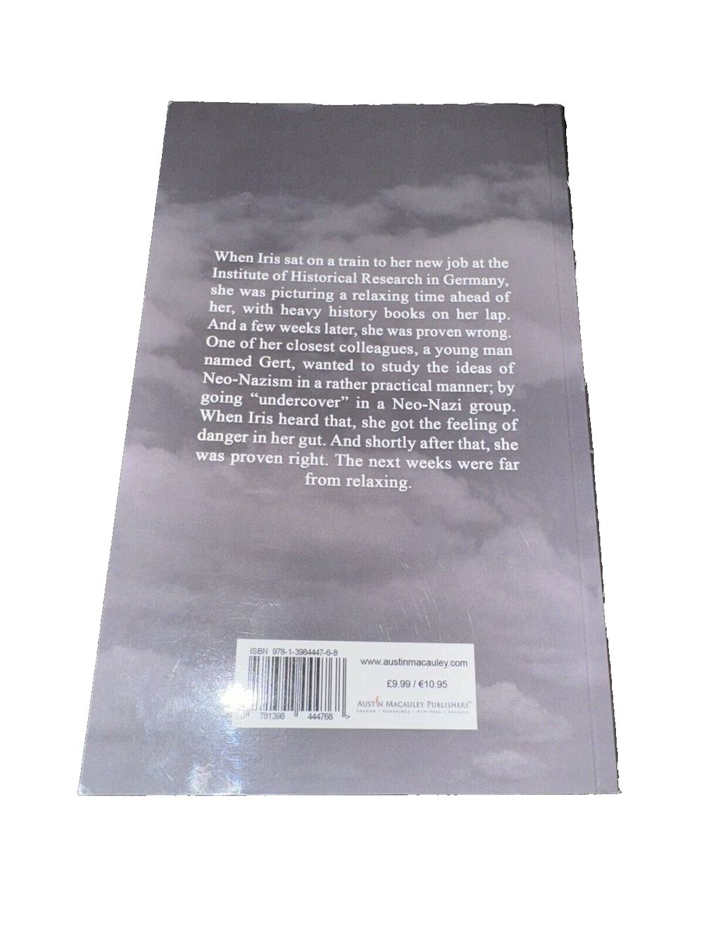 The Sense of Danger By Pia Berg, DaveyDooDeals – the book cover for the book, with a black and white image of a cloudy sky