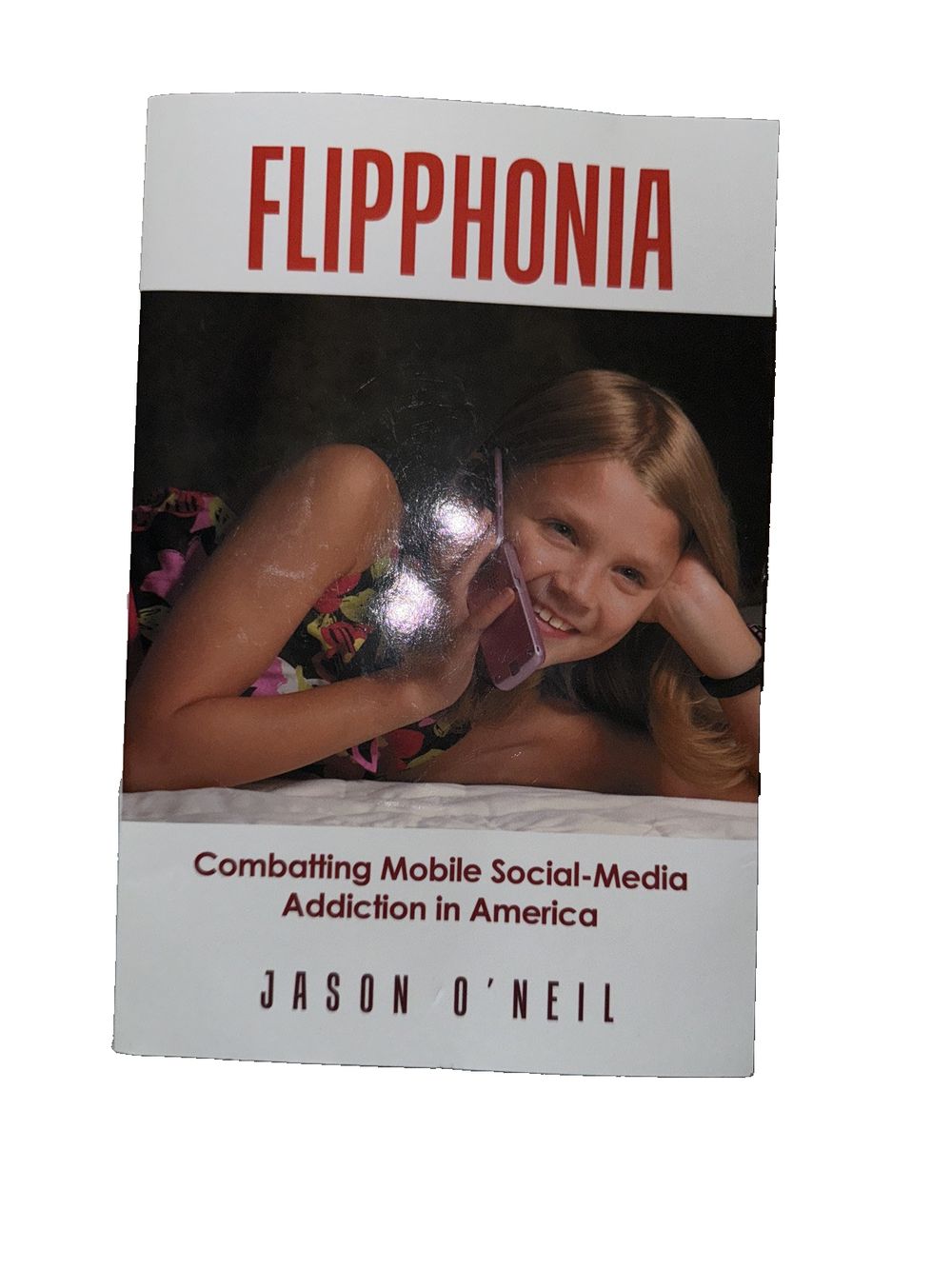Flipphonia: Combatting Mobile Social-Media Addiction in America, DaveyDooDeals – a book with a girl in the middle
