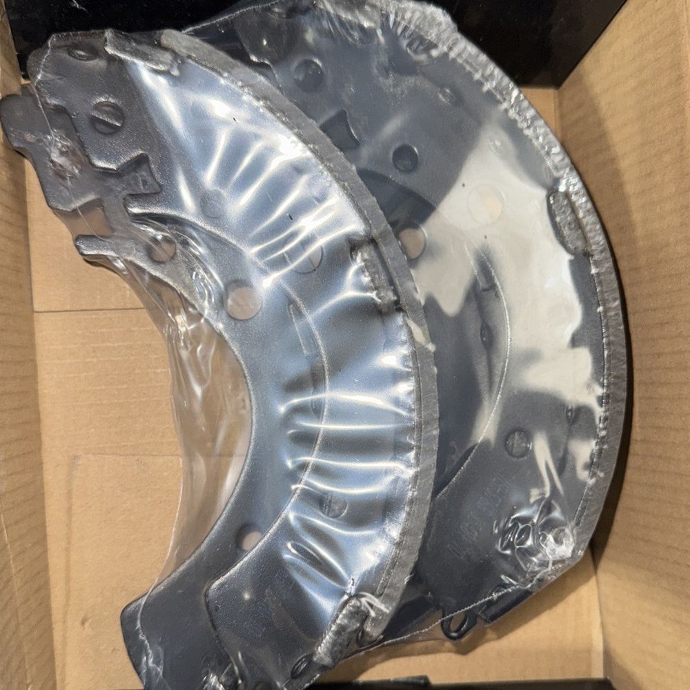 Top Quality Rear Drum Brake Shoe NB-576B – a box with a metal object inside of it