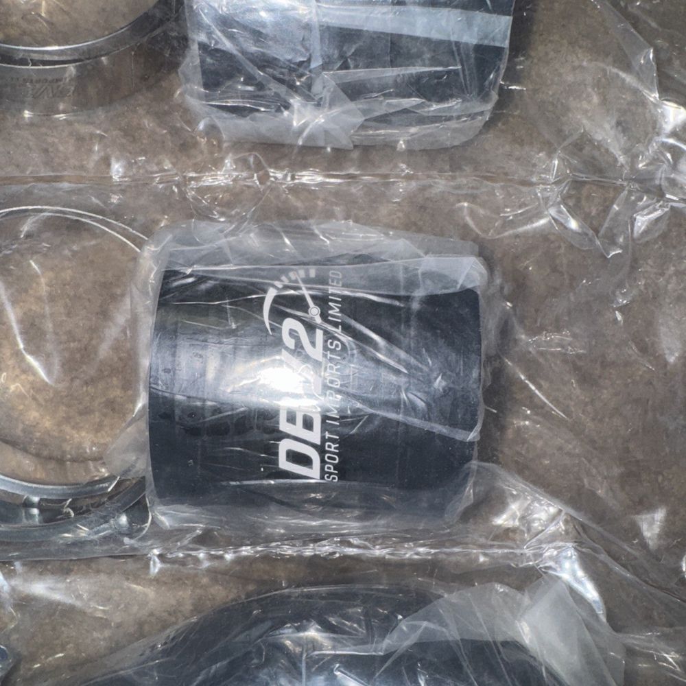 DBV2 Assortment of Parts (Please see pictures) – a bunch of plastic cups sitting on a table