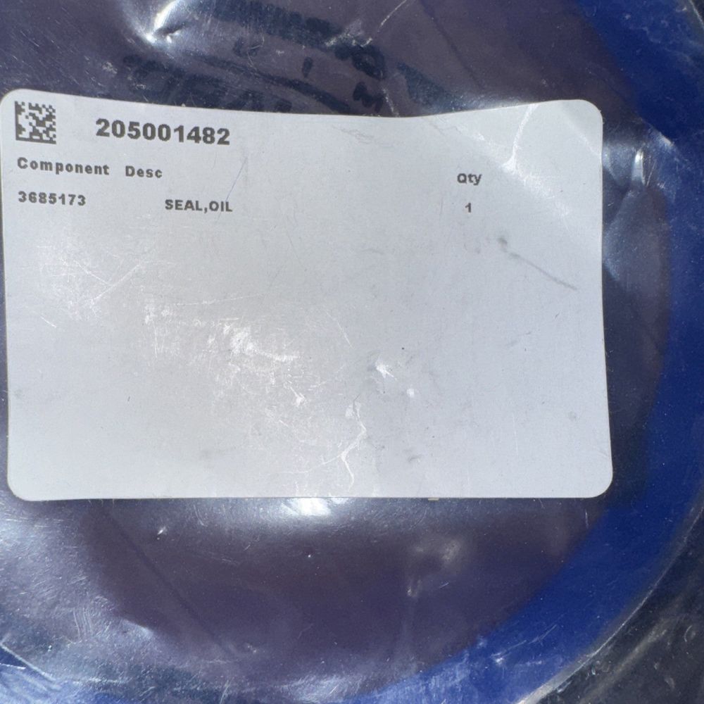 Cummins Oil Seal Part #3685173 – a white label on a blue plate