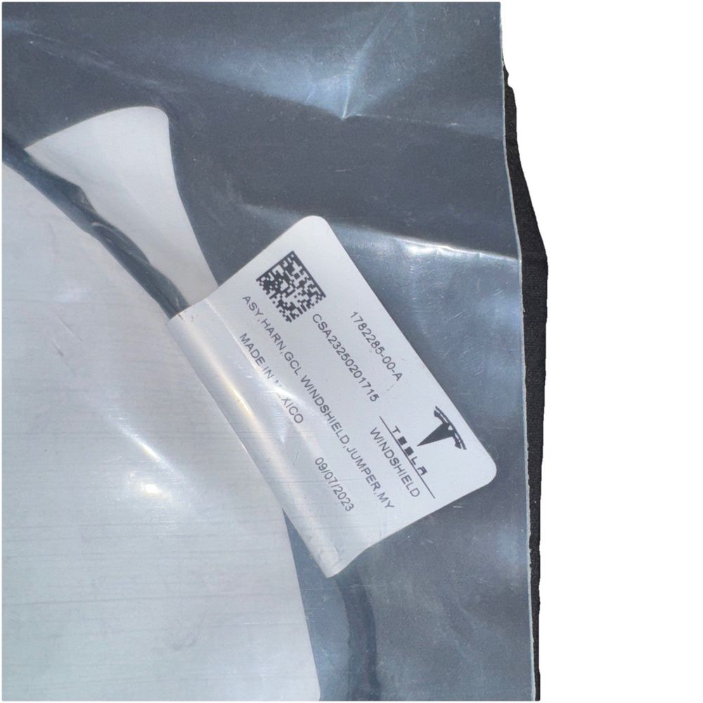 1782285-00-A Tesla Model Y Windshield Harness Assembly Retro Fit – a white plastic bag with a white label on it