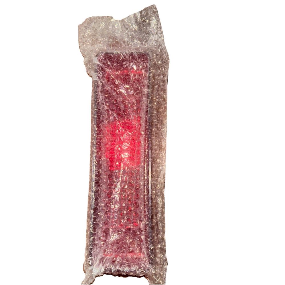 01-104-18; Rear Lens For Yamaha S/M, Unbranded – a red candle with a white background