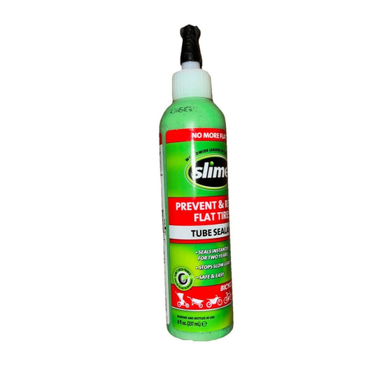 slime prevent and repair tire sealant 8FL oz – a bottle of green glue for a white background