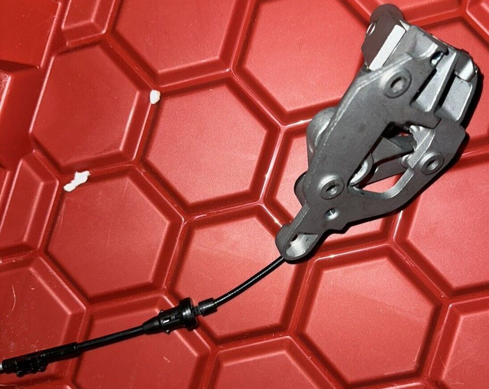 Dorman 905-101 Steering Column Shift Mechanism Compatible with Select Models – a red plastic box with a black wire