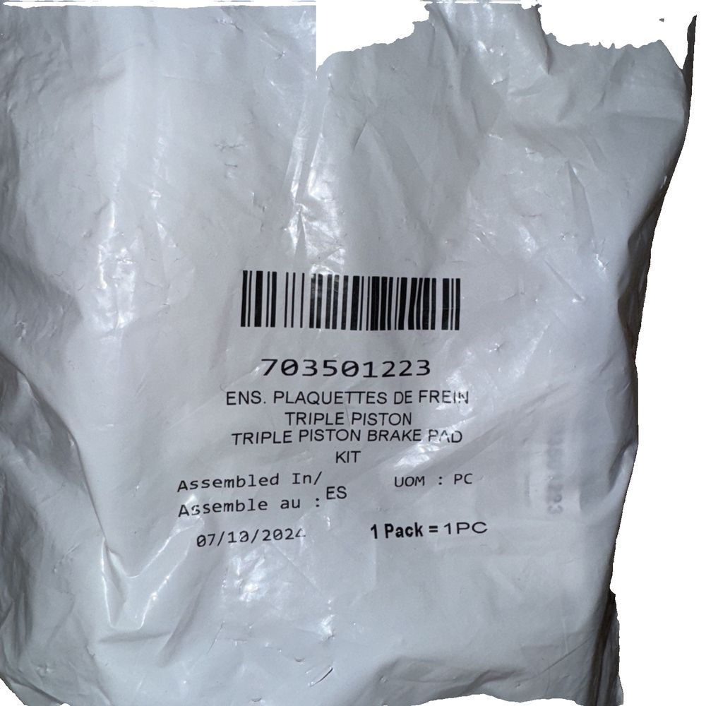 Triple Piston Brake Pad Kit 703501223, BRP – a bag of white plastic bags with a barcode on the side